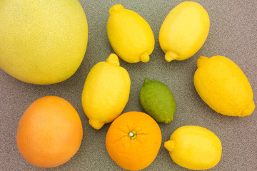 Mixed citrus fruit including lemons, orange, limes, grapefruit, pomelo