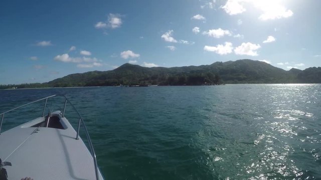 GoPro point of view from the bow of a speedboat during a boat ride, approaching  Praslin island in the Seychelles. POV.   