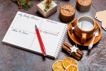 My Daily planner and cup of coffee on desk