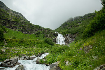 Fototapeta na wymiar Beautiful mountain waterfall in the South