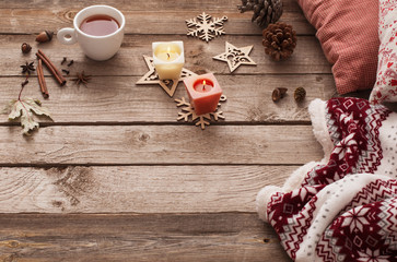 candles and Christmas decoration on wooden background