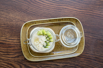 Delicious oatmeal with fresh kiwi. Breakfast