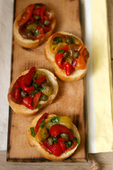 Fresh and tasty bruschetta with pickled bell pepper, capers and parsley.