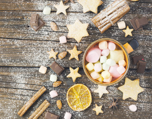 Christmas gingerbread cookies stars on a wooden table and coffe, selective focus