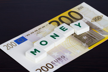Money Word with Green Letters and Euro Banknote