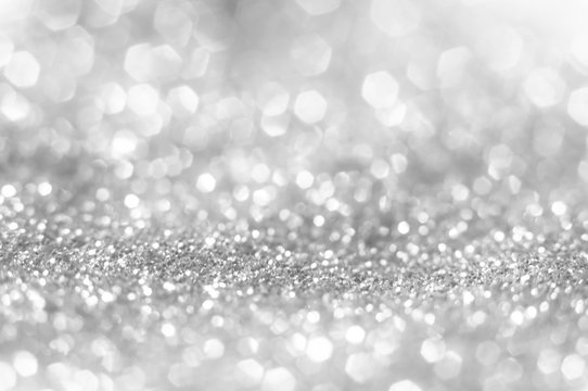 Abstract of Bright and sparkling bokeh background. silver and diamond dust bokeh blurred lighting from glitter texture