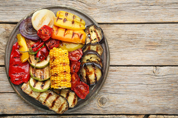 Grilled vegetable on brown cutting board