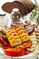 Grilled vegetable in plate with salt, pepper and bread
