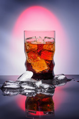 Cola in drinking glass with ice sweet sparkling carbonated drink beverage fast food with big calorie