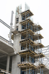 Fototapeta na wymiar Construction of a concrete house. retaining scaffolding