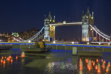 London - The Tower bridge, promenade and fountain at night.