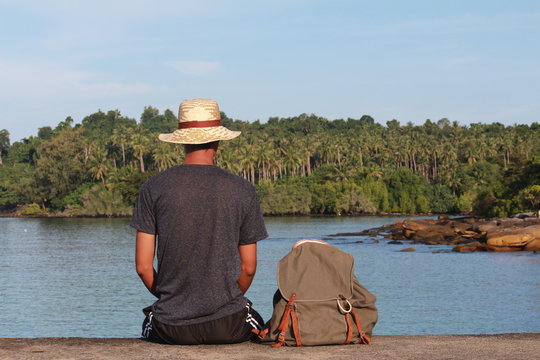 man sit with hat blue sea beautiful view wallpaper background