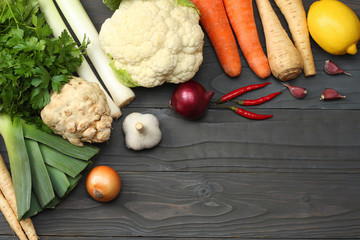 Fresh vegetables on dark wooden background. Mockup for menu or recipe. Top view with copy space