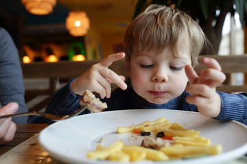 Child eating french fries