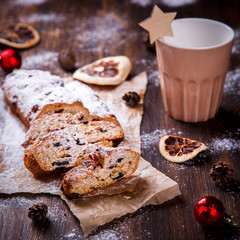 Fototapeta na wymiar Christmas or New Year pastries Holidays Concept Dresdnen Stollen is a Traditional German Cake Gift Fruit Cake for the Holiday European festive dessert Tradition of Decoration Background