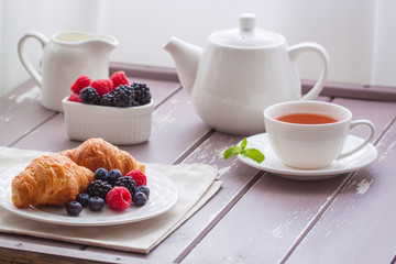 European breakfast tea coffee milk croissant fresh berries morning