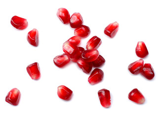 Fototapeta na wymiar pomegranate seeds isolated on white background. top view. pomegranate berries.