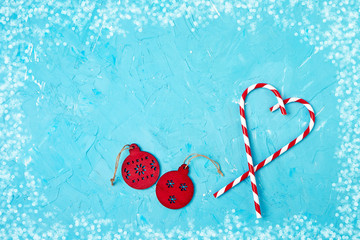 Christmas greeting card. Christmas decoration on blue background. Copy space, top view. 