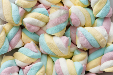 appetizing multicolored twisted marshmallows heap