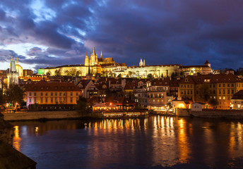 Fototapeta na wymiar Prague, Czech Republic - Night view of the city. Mala Strana neighborhood, with the Castle and the Cathedral of Prague, entitled to Saint Vitus.