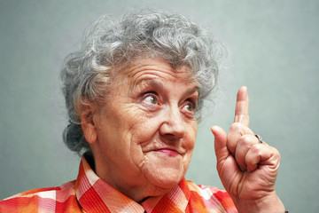 Elderly woman with finger up