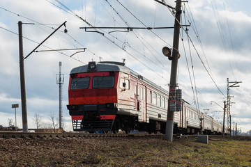 Fototapeta na wymiar Passenger train rides along the route
