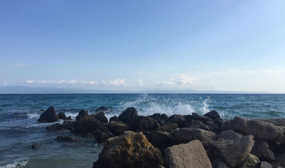 Water splashing on rocks at the sea