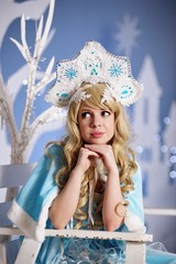 Fototapeta premium Russian Snow Maiden in blue suit and kokoshnik