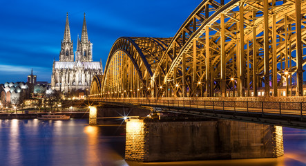 Cologne Cathedral Illuminated With Hohenzollern Bridge