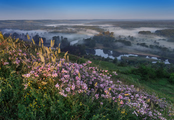 View of valley in Izum in a fog at the sunrise