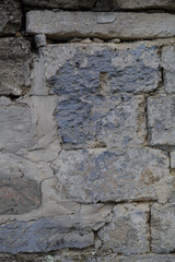 Fragment of the ancient wall. Texture. Masonry. Vertical frame