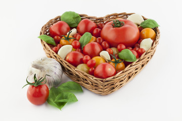 Fototapeta na wymiar Tomatoes in a heartshaped basked