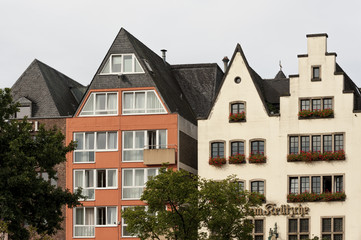 Fototapeta na wymiar COLOGNE, GERMANY - SEPTEMBER 11, 2016: Colorful houses in Bavarian style in the old town of Cologne, North Rhine-Westphalia