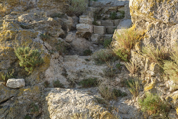 Destruction of rock. Fragment of the rock. Close-up. Horizontal