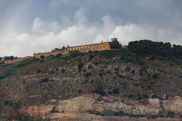 Fototapeta na wymiar Fortress on Barcelona Mountain