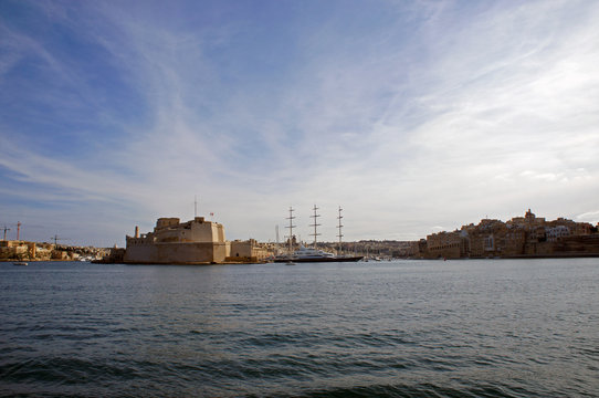 Panorama of Grand Harbor and Birgu (Vittoriosa) - Three Cities in Malta with Fort Saint Angelo and luxury yachts