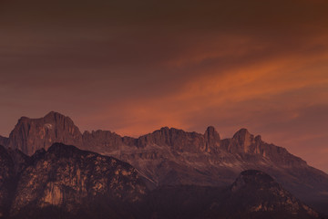 Plakat Amazing colorful clouds during autumnal sunset over Catinaccio/Rosengarten summit, Alto Adige/South Tyrol, Italy