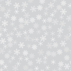 seamless pattern from white snowflakes on the grey background. Texture for cards, greeting, Christmas, new year, holiday, party