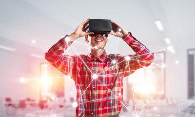 Fototapeta premium Guy wearing checked shirt and virtual mask demonstrating some emotions