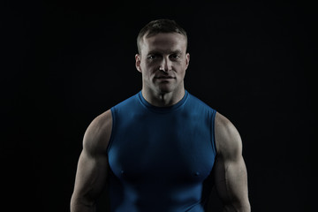 Coach sportsman in vest on chest.