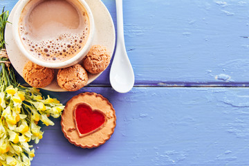 cup of coffee and bouquet of flowers decoration. sunny morning breakfast, place for lovely message