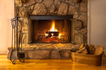 A warm fire in the stone fireplace on a cold night