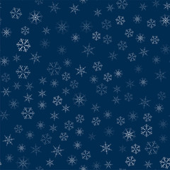 abstract seamless pattern made of snowflakes on blue. Christmas background for design of posters, postcards, invitation for the new year.