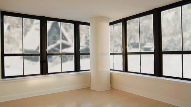 Seamless loopable background of modern living room. Outside the windows there is white snow. Rural landscape behind window. Empty room in house. Snow fall countryside indoors. Christmas eve.