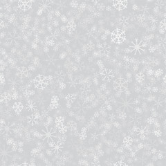 Fototapeta na wymiar seamless pattern from white snowflakes on the grey background. Texture for cards, greeting, Christmas, new year, holiday, party