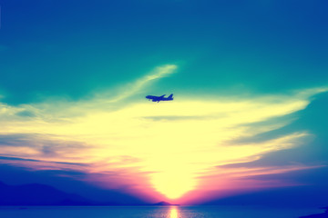 Fototapeta na wymiar soft and blur focus airplane with colorful sky