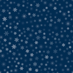 abstract Christmas seamless pattern from white snowflakes on a blue background. For holiday, new year, celebration, party.