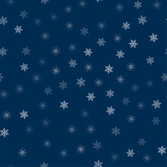 abstract Christmas seamless pattern from white snowflakes on a blue background. For holiday, new year, celebration, party.