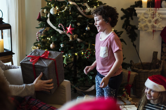 Young Caucasian boy with Christmas present box