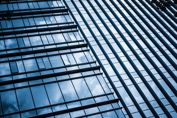 Clouds Reflected in Windows of Modern Office Building..